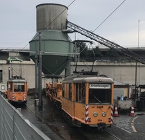 Work train equipment for Frankfurts tram system rests under a ballast chute x-post from rtrains