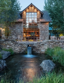 Wyoming Residence -Story Windows face Beautiful Stone Patio over Waterfall amp Pond 