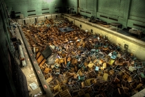 x This abandoned university in New York disposed of every desk book and chair by dumping them all in the gym pool