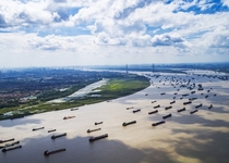 Yangtze river traffic with Wuhan city skyline 
