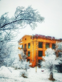 Yellow building in snow Armenia 