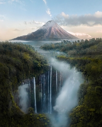 You might have seen it before but heres that one place in Indonesia with a volcano behind waterfalls 