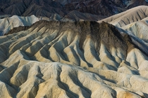 Zabrinskie Point --- Death Valley National Park --- composed of sandstone clays minerals and even lava formed over millions of years ago 