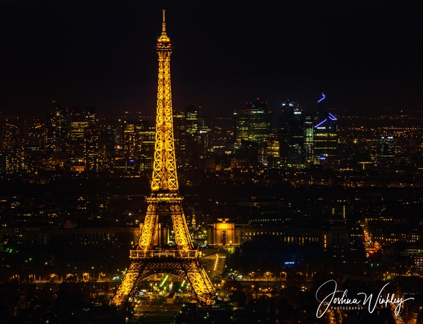 A beacon like Eiffel Tower with a backdrop of La Defence Paris France 