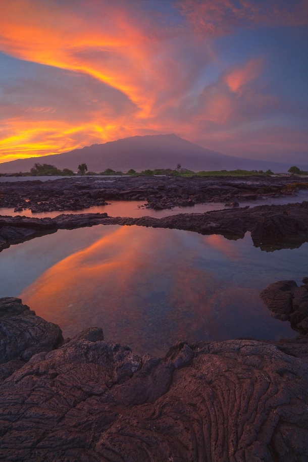 A blazing sunrise and Mauna Loa Hawaiis Big Island during the Lower Puna eruption June of  