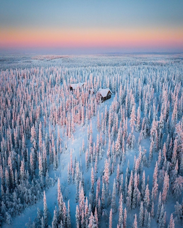 A cabin in the wintery woods of Finland