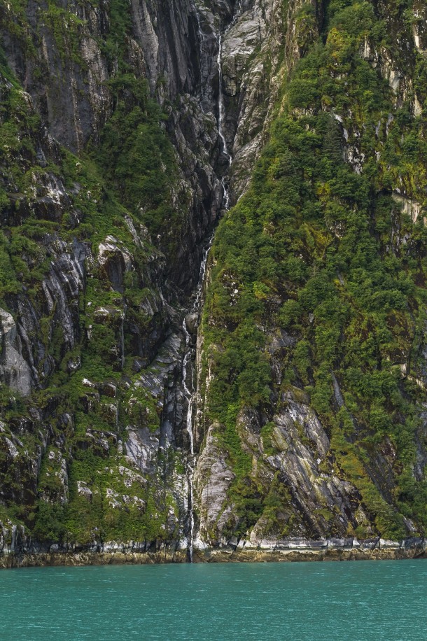 A cleft in the rock craved by waterfall - at Tracy Arm fjord Alaska 