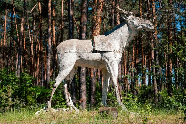 A crumbling concrete elk in an abandoned Soviet Young Pioneers Camp - similar to Scouts 