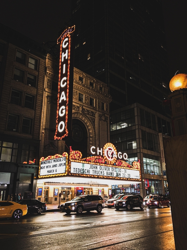 A dark and gloomy night lit up only by the bright lights of Chicagos most iconic theatre