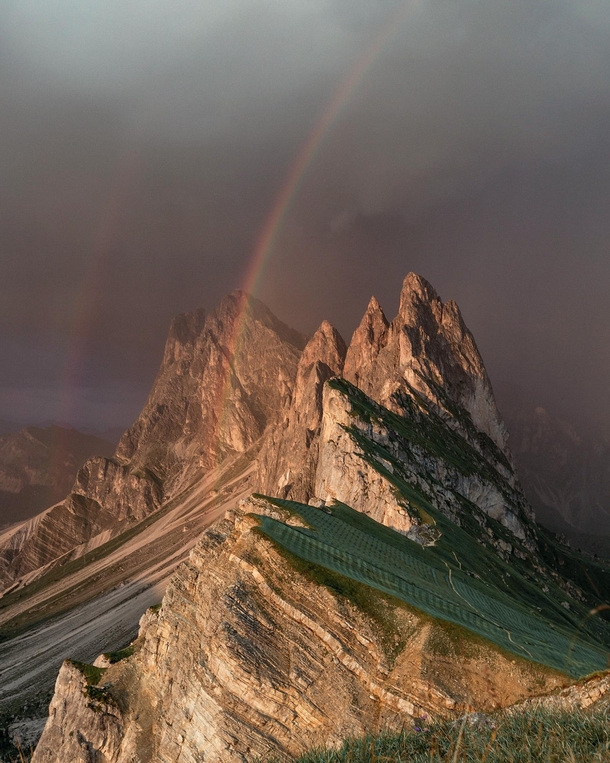 A double rainbow appearing as a storm rolled in over the Dolomites 