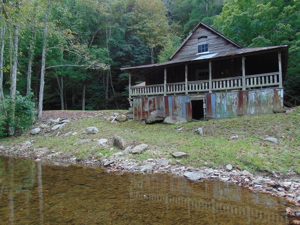 A forgotten cabin in the Cherokee National Forest Due to its isolation from civilization it remains untouched and frozen in time A flash flood recently washed away the driveway a smoke house and partially destroyed the nearby barn Monroe County TN