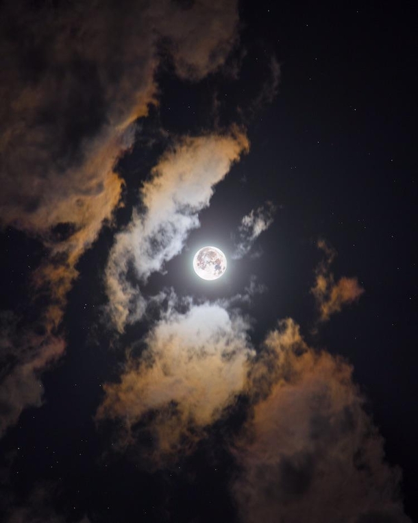 A full moon forming ring of beautiful color in the clouds HDR image created by combining  images