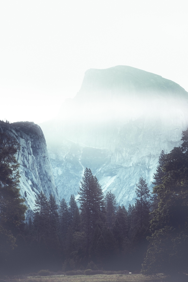A giant peaking through the clouds Yosemite California 