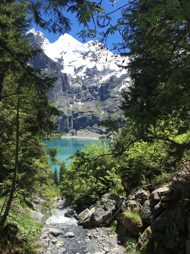 A glimpse of Oeschinensee Switzerland with Blemlisalp in the background 