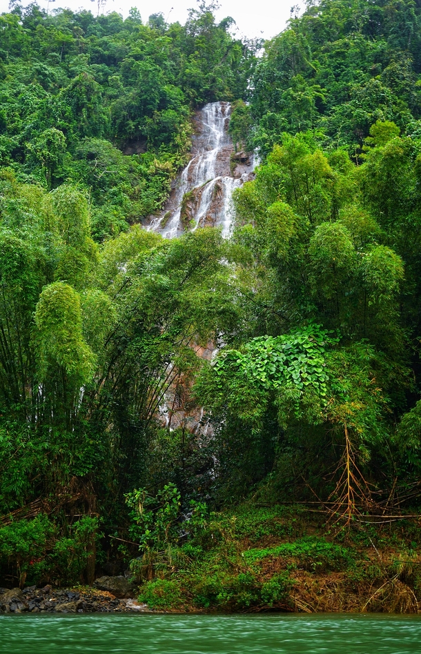 A gorgeous waterfall off the Navua River in Fiji 