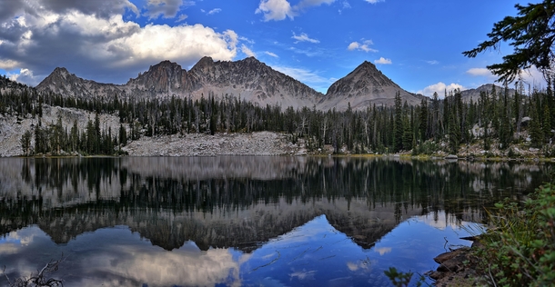 A high mountain lake in the Sawtooths of Idaho reflects and gives pause for reflection 