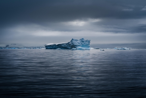 A lonely iceberg passing by in the Lemaire Channel of Antarctica Easily the most isolated place I have ever been 