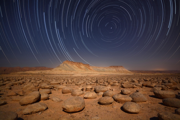 A long exposure during a full moon night at Limestone nodules filed - Negev desert - Israel 