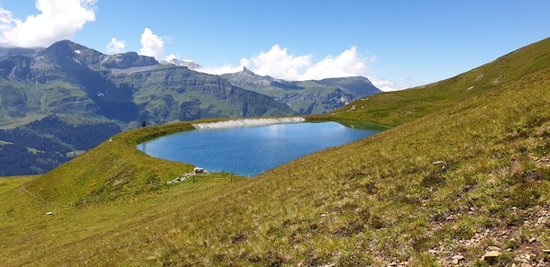 A lovely blue lake on a Mt Lauberhorn in Switzerland OC x