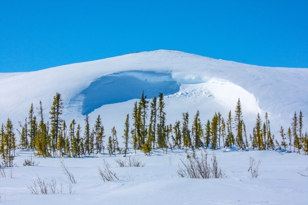A massive snowdrift in the remote Canadian Tundra Northwest Territories 