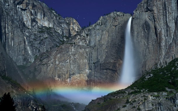 A moonbow or lunar rainbow is cast by the Yosemite Falls California 