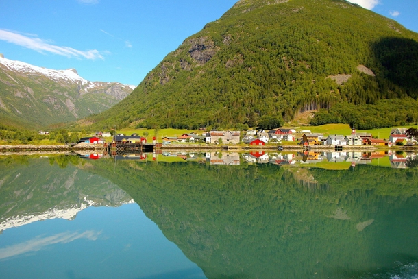 A Norwegian Village Over The Fjords and Its Reflection 
