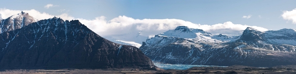 A  panorama I stitched together of some dramatic mountains in Iceland with a glacier poking out from the middle  liamsearphoto
