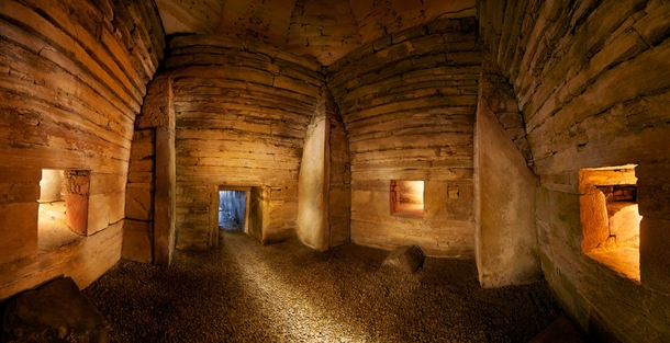 A panorama of the interior of Maeshowe a  year old chambered burial cairn on the island of Mainland Orkney Scotland on the eve of the Winter Solstice The cairn is aligned so that light directly strikes the back wall on this date 