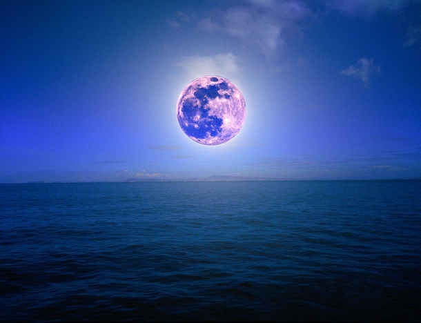 A pink supermoon composite on ocean