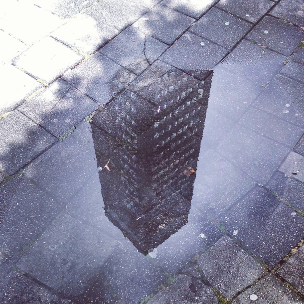 A puddle on the sidewalk in Leeuwarden the Netherlands 