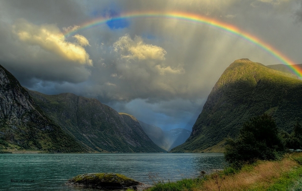 A rainbow over the beautiful Jlstravatnet lake Norway  photo by Rune Askeland