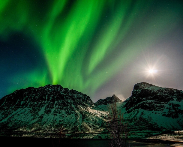 A rare capture of a supermoon AND northern lights in one picture - from Troms in Norway   more of my aurora shots at Insta glacionaut