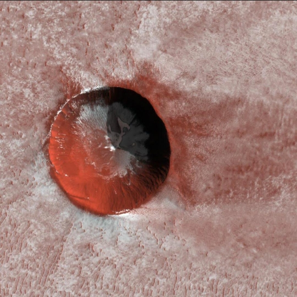 A relatively young ice-filled crater near the north pole of Mars Credit MRO HiRISE