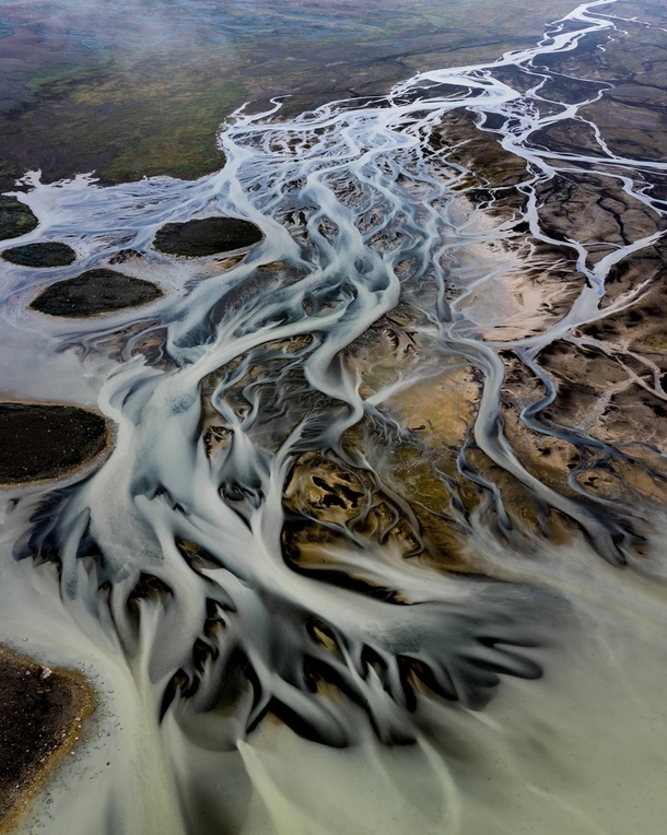 A river in Iceland creating a surreal looking landscape  - more of my abstract landscapes at insta glacionaut