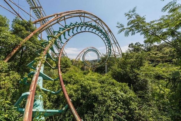 A rollercoaster being swallowed up by the forest in this abandoned Japanese theme park 
