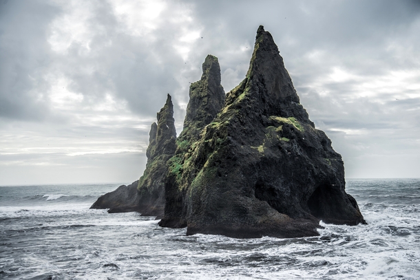 A sea stack off the coast of Iceland  Photographed by Romain Ribaud