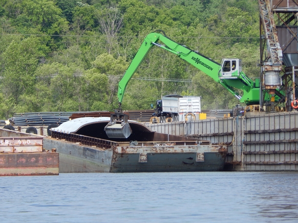 A Sennebogen barge unloader unloading a barge near St Paul MN 