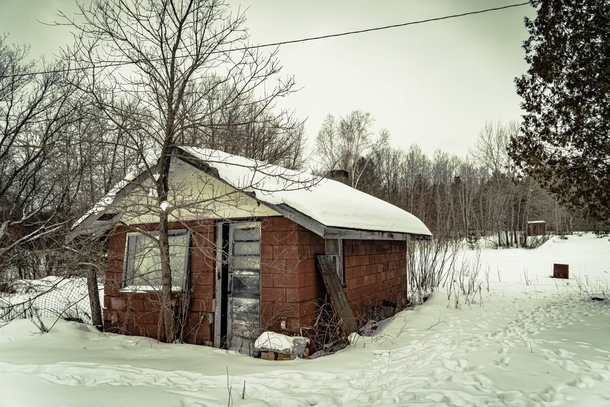 A small abandoned house in the snow