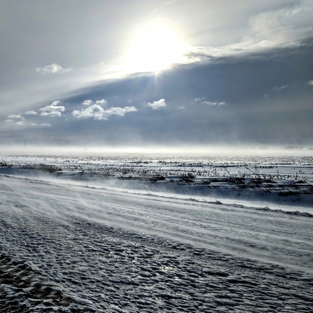 A snow covered amp wind blown field in Nebraska