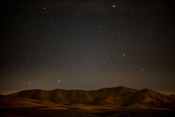 A starry night over the desert hills in Fuertaventura 
