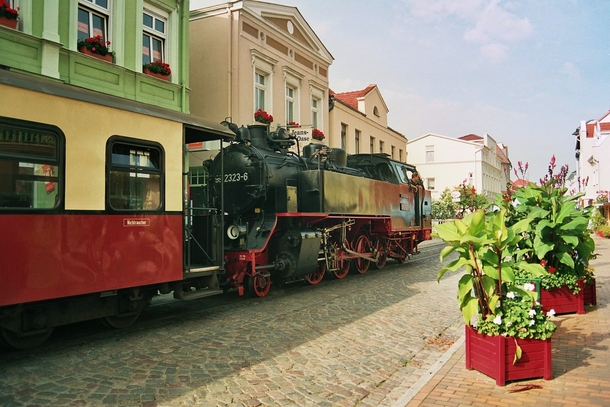 A steam train going down the street in Bad Doberan Germany