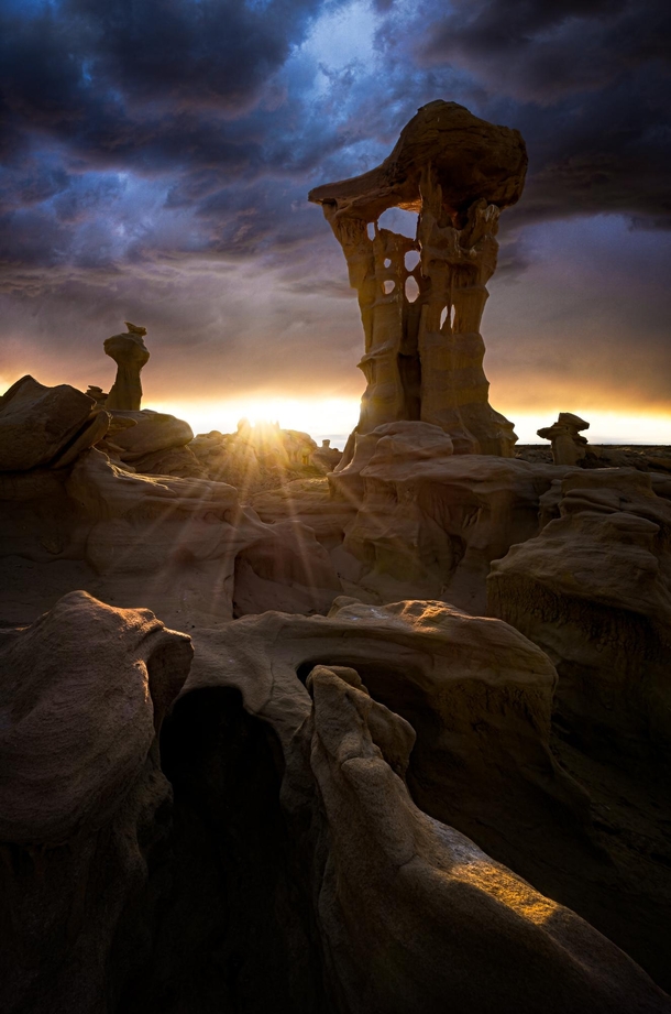 A stormy sunset in a remote part of New Mexico with these insane rock formations 