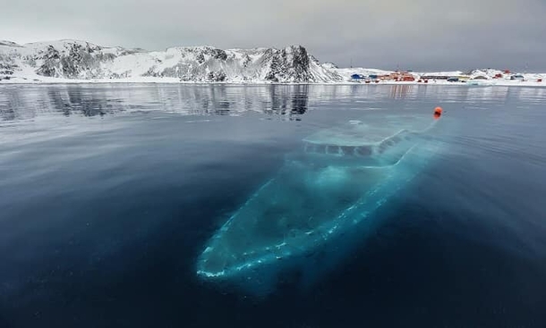 A Sunken completely frozen yacht in Antarctica