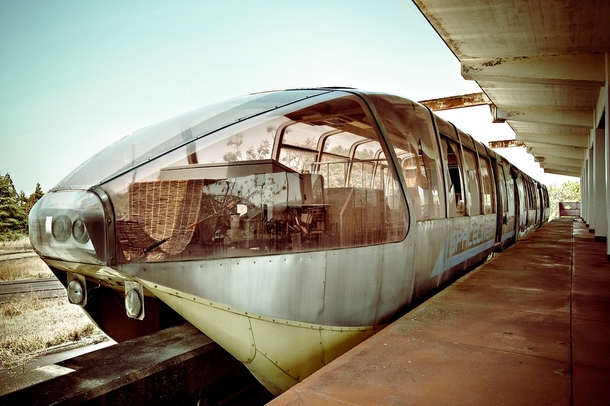 A train at an abandoned monorail station platform  by Lusker 