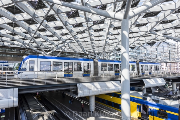 A tram stop over train platforms in The Hague Central Station Netherlands