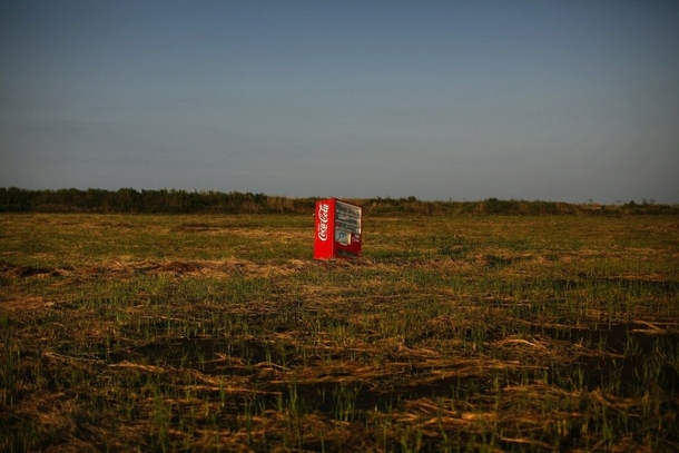 A vending machine brought inland by the catastrophic  tsunami in an abandoned rice field in Fukushima Japan 