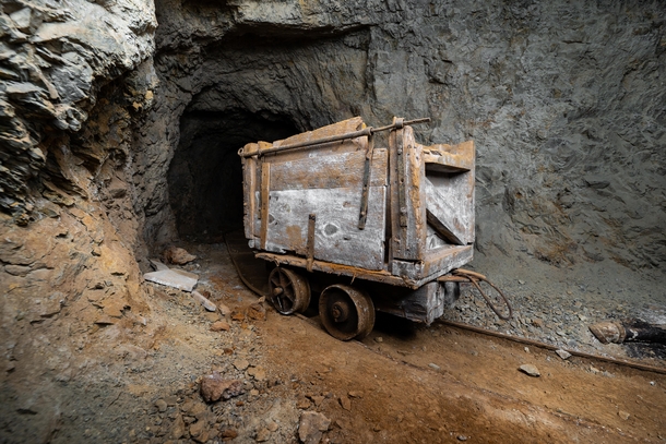 A very old handmade ore car in an abandoned mine 