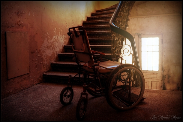 A wheelchair in the abandoned Lyster Sanatorium in Norway  by Jim Andre Aune