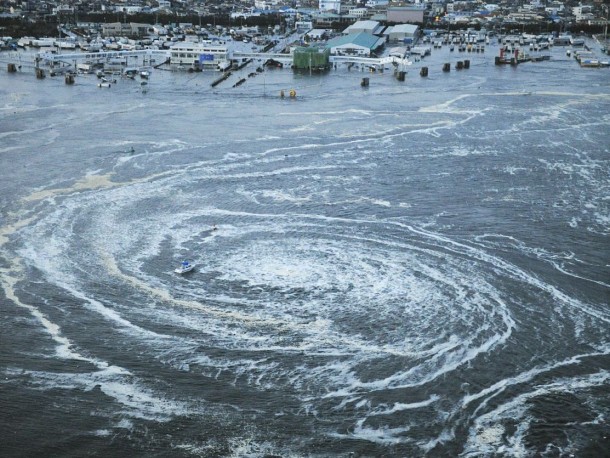 A whirpool forms off the Japanese coast after the tsunami on March  