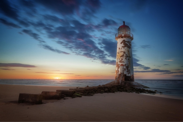 A worn-down lighthouse near Talacre Wales  by Andy Wilson